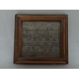 An embroidery sampler of the alphabet by Caroline Smith aged 9, dated 1852, Philadelphia,