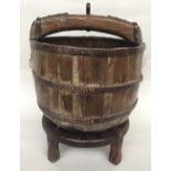 A vintage wooden water pail/well bucket with iron bindings on stand 45cmD