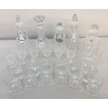 A selection of four decanters in cut crystal three with Gin, Whiskey,