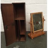 A lockable oak wall hanging cupboard with internal dividers together with a pine toilet mirror