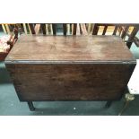 An antique drop leaf dining table 71cmH