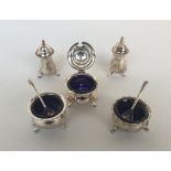A silver plated Mappin & Webb condiment set comprising pairs of pepperettes,