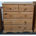 A small pine chest of drawers two short over three long,