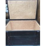 A stained wood rectangular trunk lined with cork board with hinged lid 77 x 49 x 38cm
