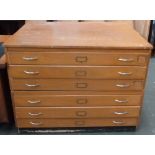 A mid-century plan chest with six drawers with twin chrome handles and metal label holders