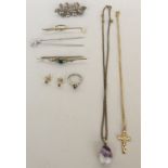 A small set to include an amethyst pendant with chain, a bright cut cross with chain, two hat pins,