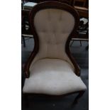 A cream upholstered balloon back button back bedroom chair raised on cabriole legs