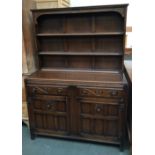 A Mahogany dresser with two shelves above two drawers over two cupboards with interior shelves 120