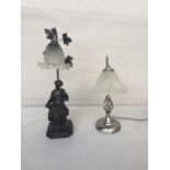 Two modern desk lamps - one Art Deco with metal base and figure of a lady reading a book both with