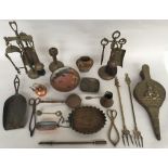 A mixed lot of brass and copper items to include a bellow, fire companion,