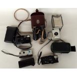 A set of four cameras in carry case with instructions to include a Kodak pocket instamatic 300,