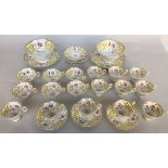 An early Victorian London pattern part tea service of yellow and gilt design with hand painted