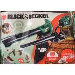 A Black and Decker leaf blower and accessories