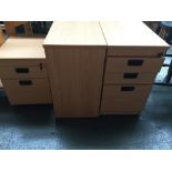 A pair of modern filing cabinets with keys,