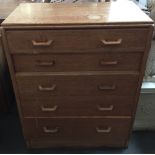 A mid-century G Plan chest of 5 graduating drawers,