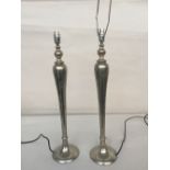 A pair of tapered silver colour table lamp on a round base 64cm H