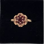 A 9ct gold ring with garnet or red stone, hallmarked WG Birmingham 1978,