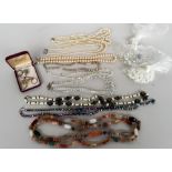 A selection of costume jewellery necklaces and rings