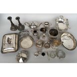 A large quantity of silver plate and white metal items including a teapot, serving trays, jugs,