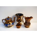 A selection of copper lustreware including a Beswick vase,