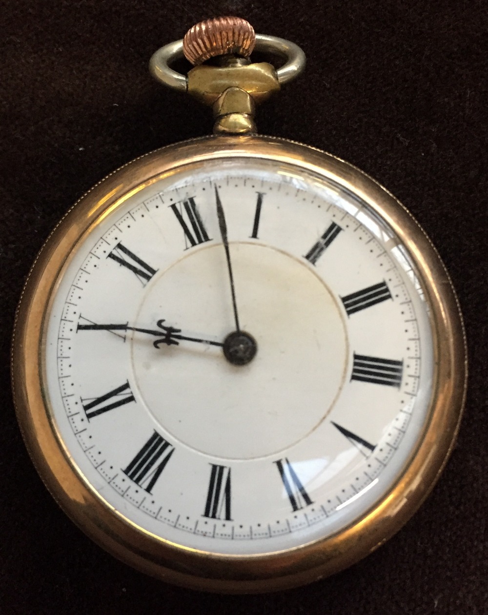 An open faced gold plated pocketwatch, with a white dial with black Roman numerals, Octava movement,