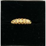 An 18ct gold ring with five diamond chips, hallmarked Viner's Ltd (Emile Viner) Birmingham,