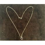 A 9ct gold chain with heart shape pendant, hallmarked, 0.