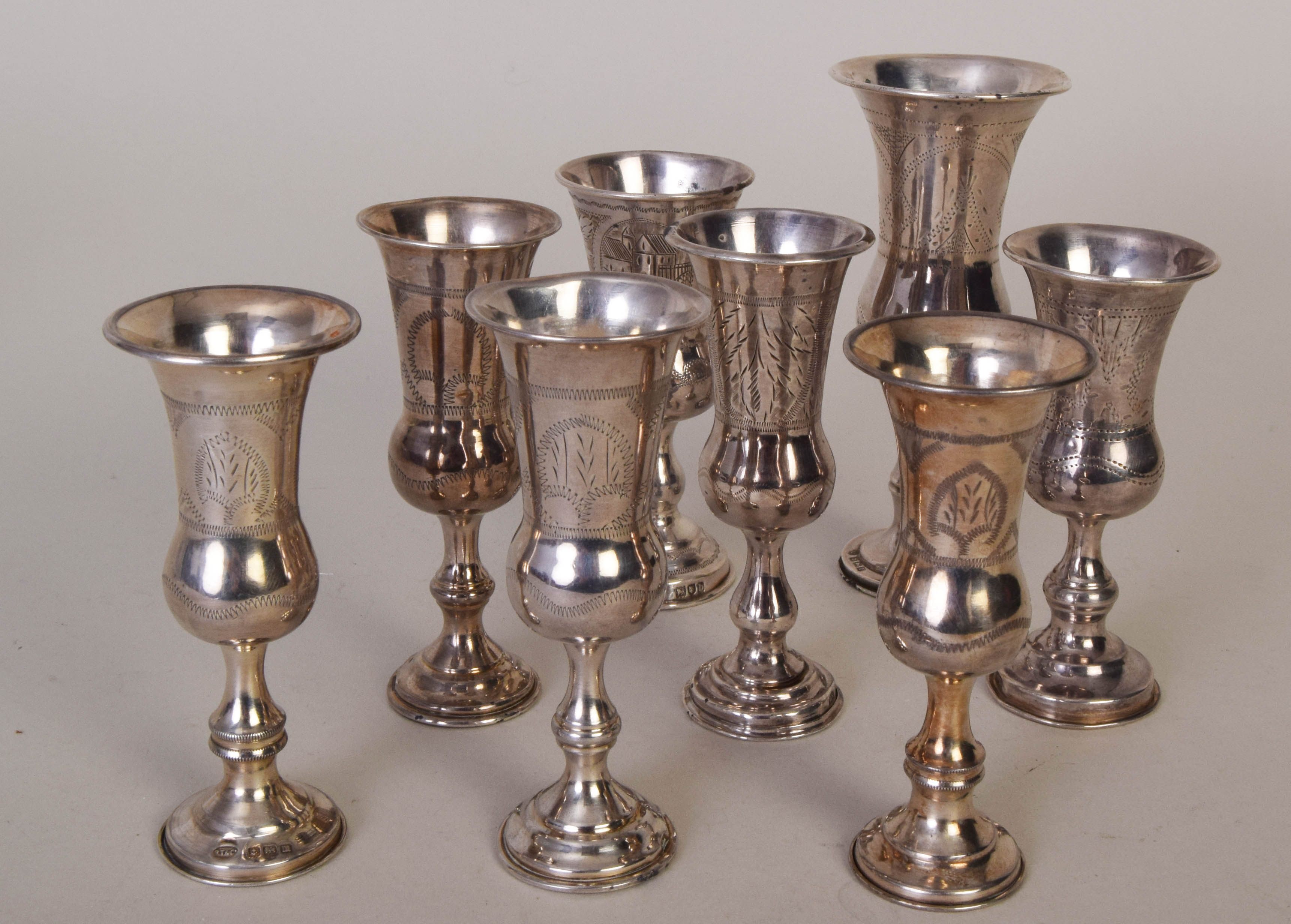 Eight silver posy vases with etched decoration, the tallest 12cmH, the rest 10cmH, various makers,