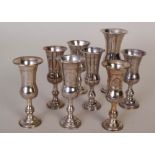 Eight silver posy vases with etched decoration, the tallest 12cmH, the rest 10cmH, various makers,