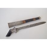 An unusual dagger with hardwood and metal hilt complete with a metal and wooden scabbard with