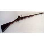 A 19th century flintlock rifle with wooden stock,