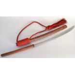 A Burmese dha/dao sword complete with wooden scabbard and decorative red rope,