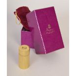 A gilt metal pepper mill made in Italy and sold through Asprey with original purse and Asprey box,