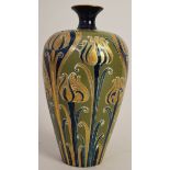A Macintyre Moorcroft vase of baluster form in the 'Green and Gold' pattern,