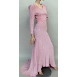 A 1930s bias cut and fitted full length dress with sweetheart neckline and ruched bodice.