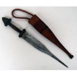 An eastern dagger with woven red and black leather hilt and red and brown leather scabbard,