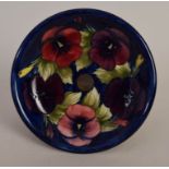 A Moorcroft Tudric 'Pansy' pattern circular tazza on a hammered pewter foot,