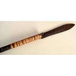 A blowpipe/blowgun with attached spear possibly from Borneo,