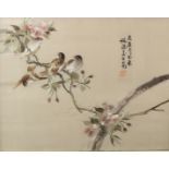 A pair of Chinese silk embroidery works, both depicting small birds on cherry blossom, circa 1930s,