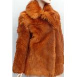 A 1960s/70s vibrant orange coloured fur jacket. Garment is lined and labelled 'Echt Pelz'.