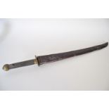 A Japanese sword with a brass and leather hilt complete with a leather scabbard,