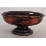 A Moorcroft circular fruit bowl, decorated on the interior and exterior with peaches,