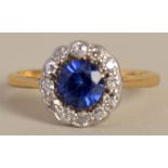 A gold sapphire and diamond cluster ring,