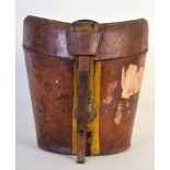 A leather top hat travel case with quilted red silk interior and vintage travel labels, 30cmW,