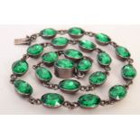 A sterling silver and green paste necklace, marked 825,