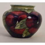 A Moorcroft posy vase in the 'Pansy' pattern, stamped on the base with 'Moorcroft Burslem M55 C',