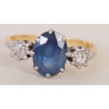 A sapphire art deco style ring with two diamonds to either side set in an 18ct band,