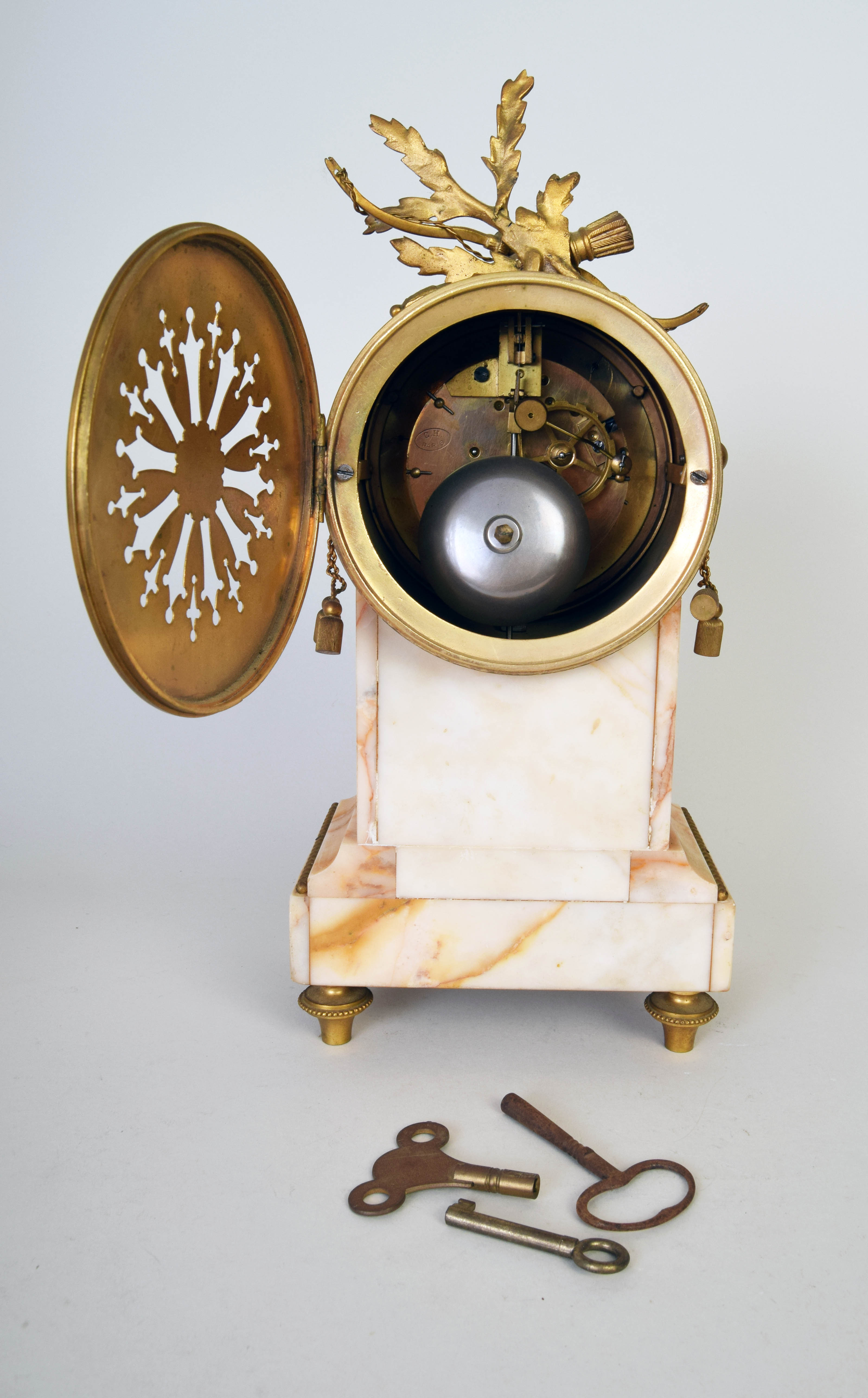 A Louis XIV style gilt and marble clock garniture with trophy crest and enamel dial, - Image 2 of 2