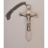 A large silver crucifix on a chain, engraved on the reverse with 'In Te Domine Speravi' and 'E.W.