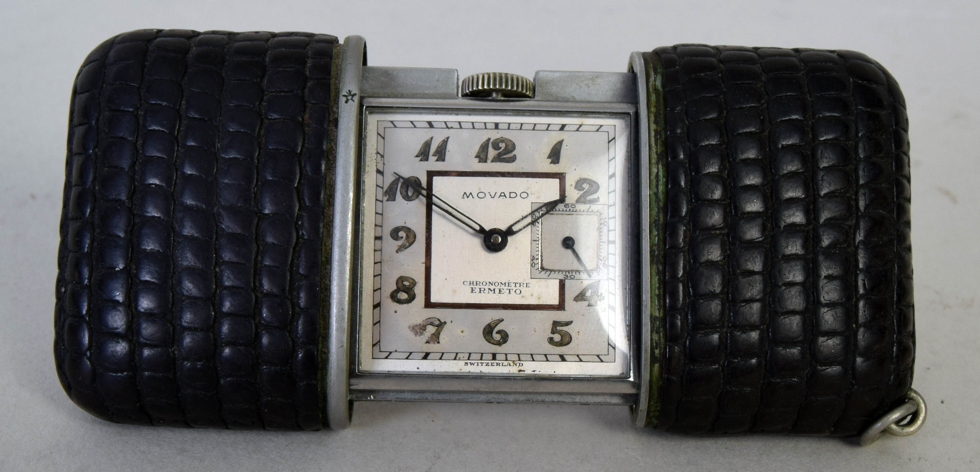 An early 20th century Swiss made Movado Ermeto Chronometre hermetic travel watch,